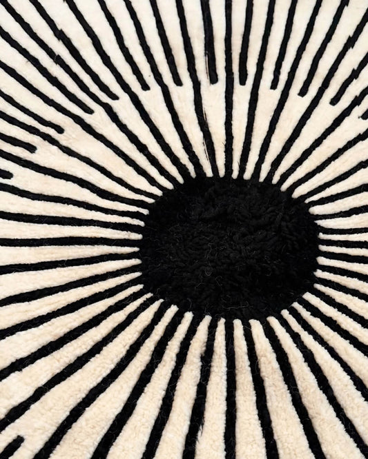 sunburst hand tufted round wool rug closeup