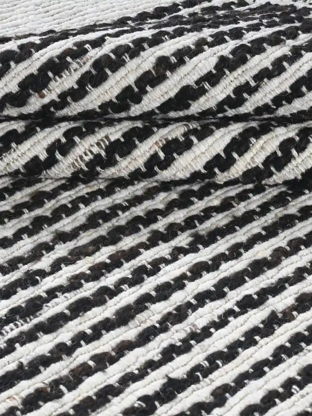 black and white stiped woven jute rug
