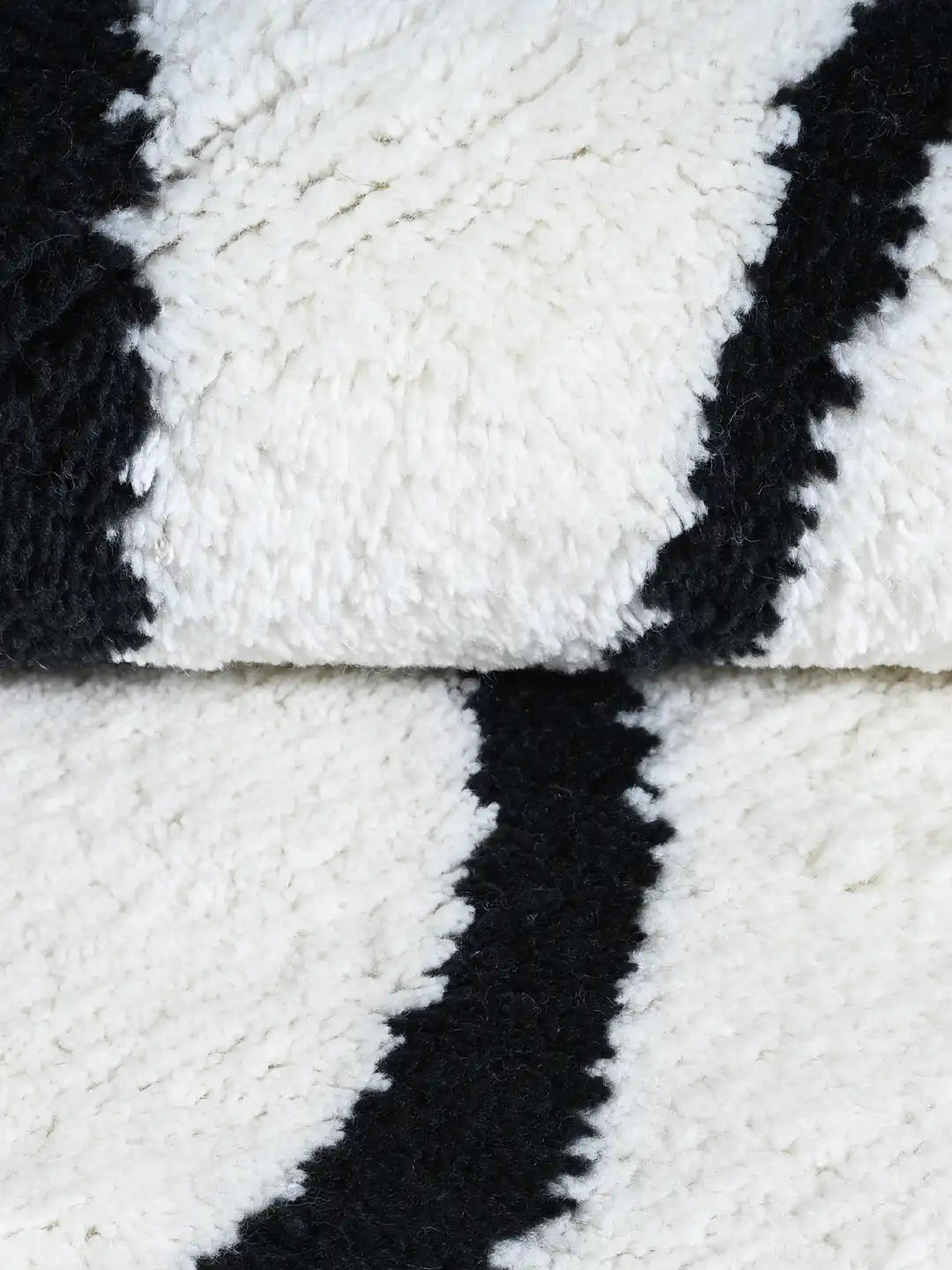 Close-up of a black and white wool rug