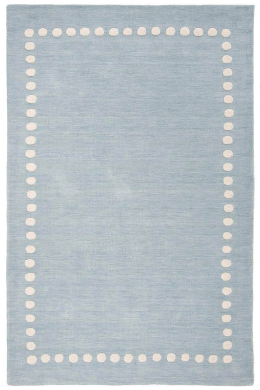 cera light blue tufted area rug with a cream dotted border