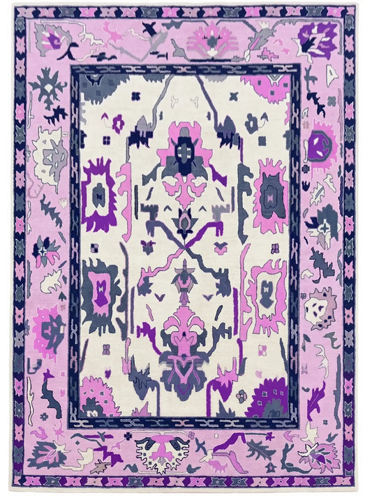 hand knotted wool area rug with a traditional ornamental pattern