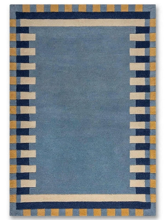 citing area rug with a solid medium blue center, bordered by alternating colors
