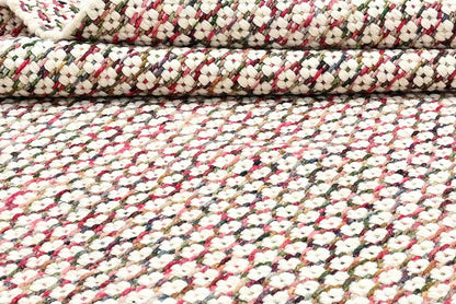 close-up of a hand woven patterned wool area rug