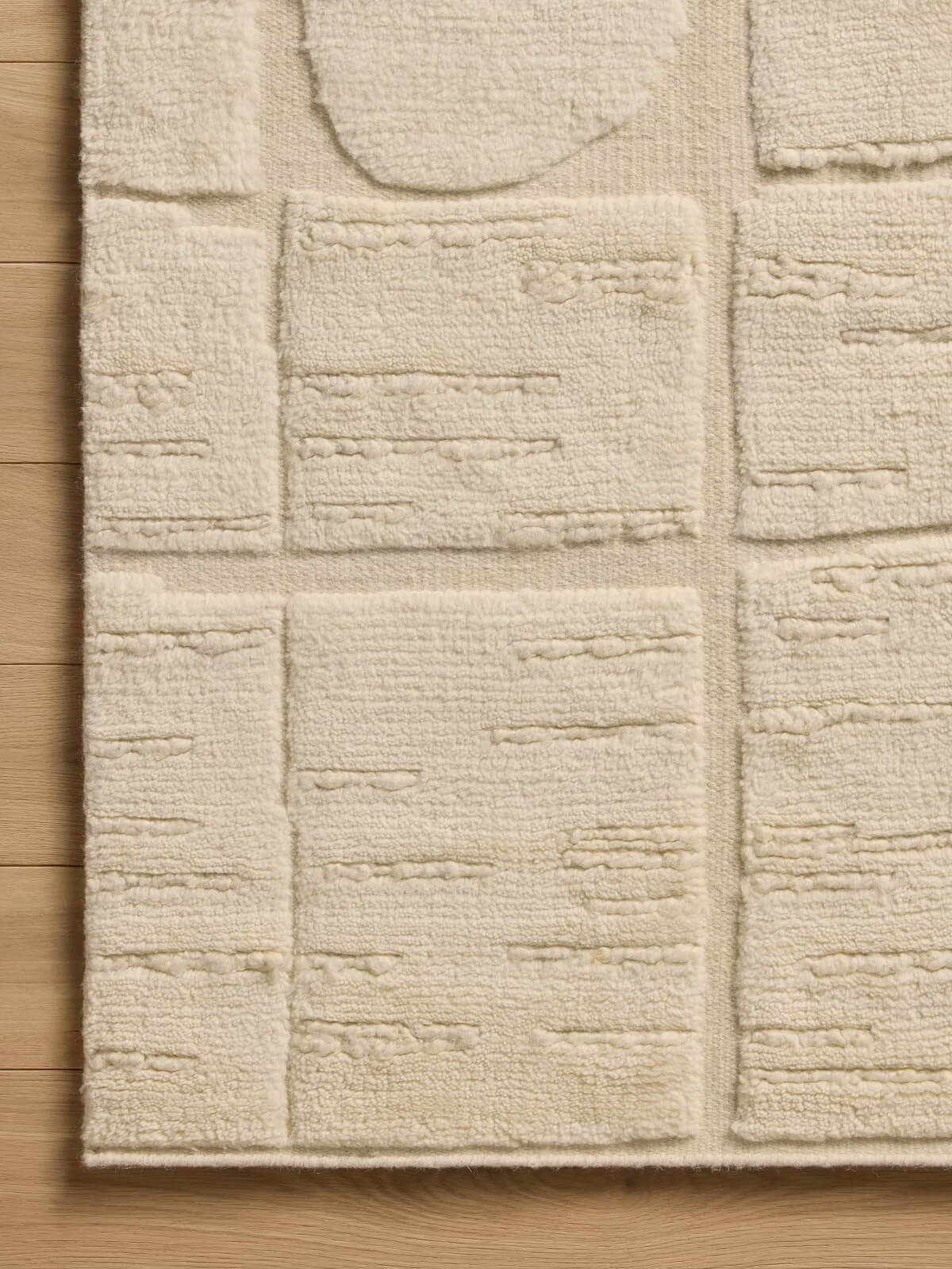 beige knotted wool rug close up