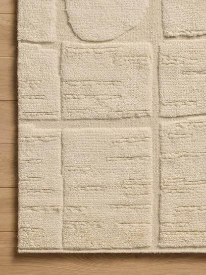 beige knotted wool rug close up