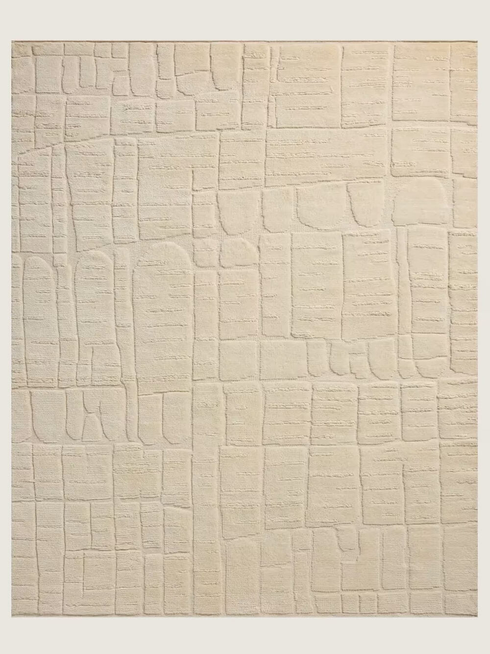 beige textured hand knotted wool rug