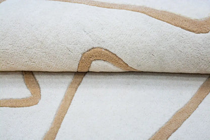 Close-up of a beige line and white patterned rug