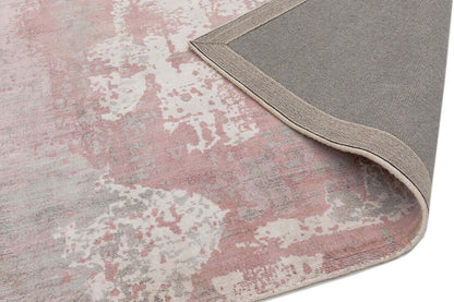 Close-up of a hand woven blush pink viscose rug corner
