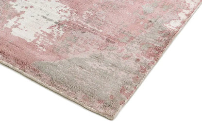 close-up of hand woven blush pink viscose abstract rug