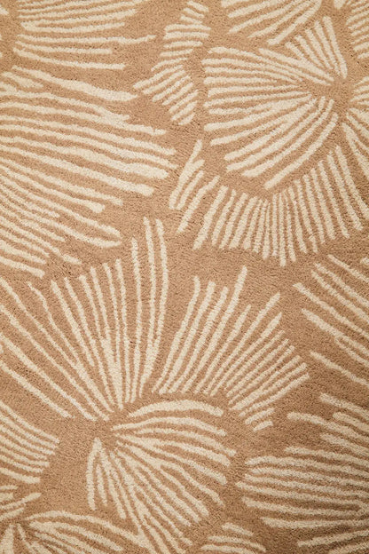 Close-up of a beige floral patterned rug