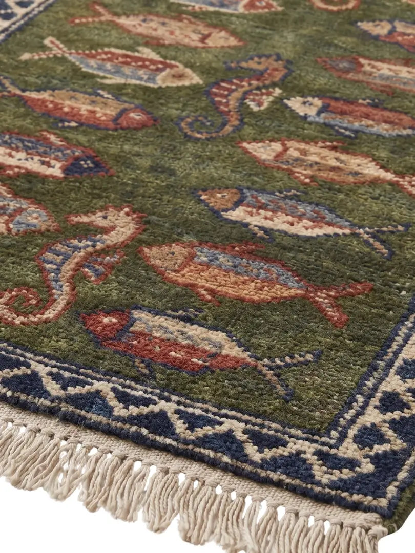 A close-up of a patterned runner rug, hand knotted