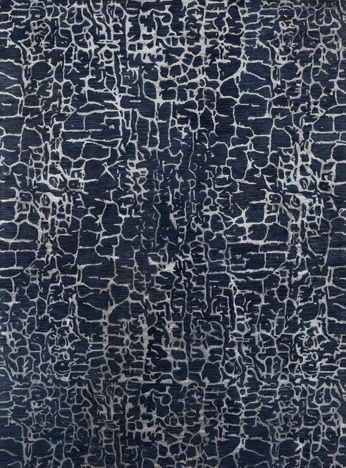 modern hand tufted wool rug with a dark blue and white pattern