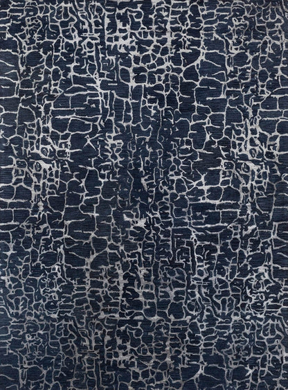 modern hand tufted wool rug with a dark blue and white pattern