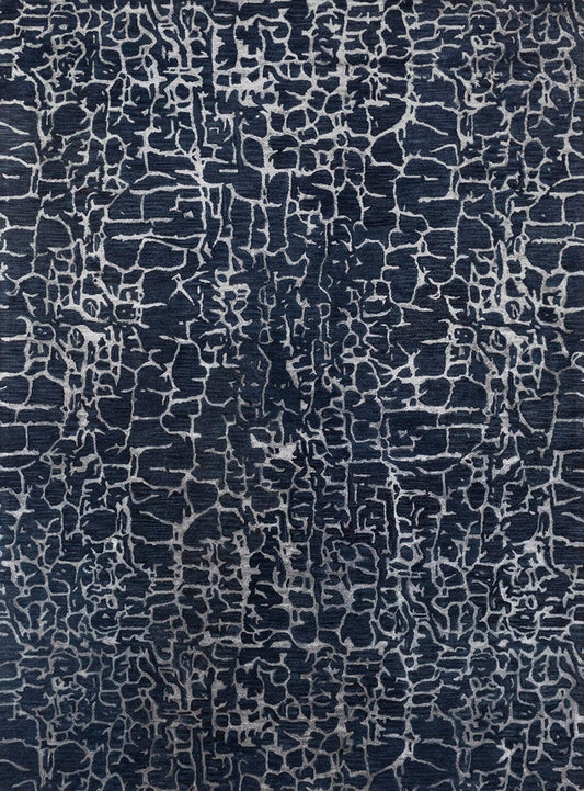 modern hand tufted wool rug with a dark blue and white pattern