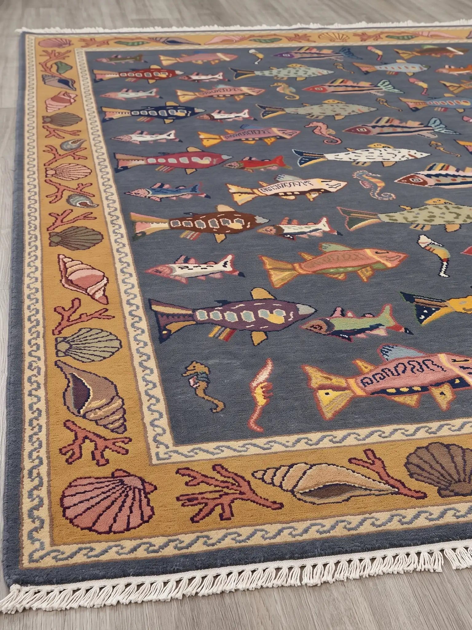 hand tifted area rug with colorful pattern of fish