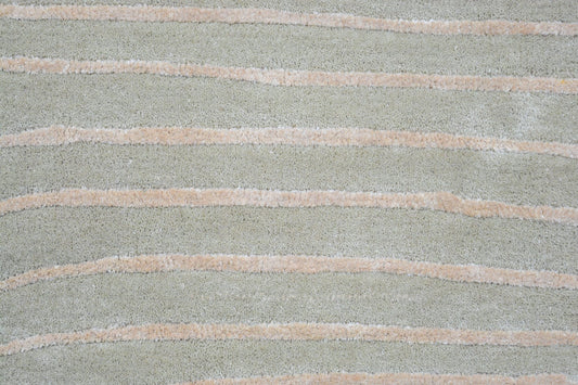 grey shaped wool rug, close view