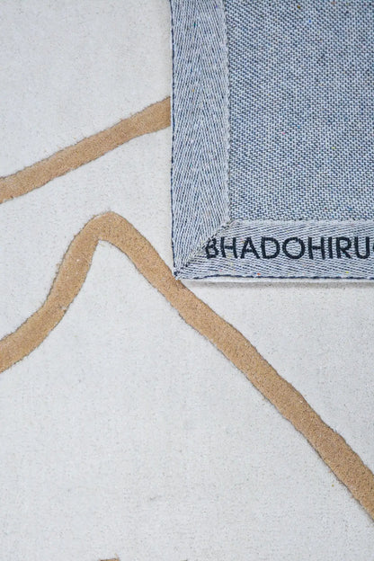 close view of bhadohirug's modern wool rug with geometric pattern
