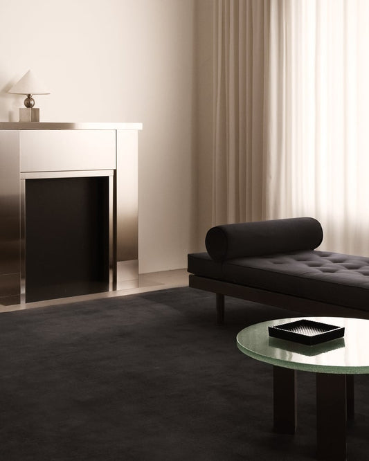 living room with rich black hand-tufted wool rug