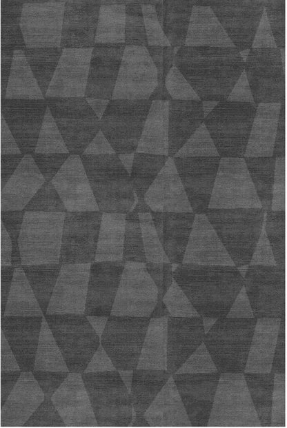 Geometric patterned hand tufted wool rug with triangles in various shades of gray.