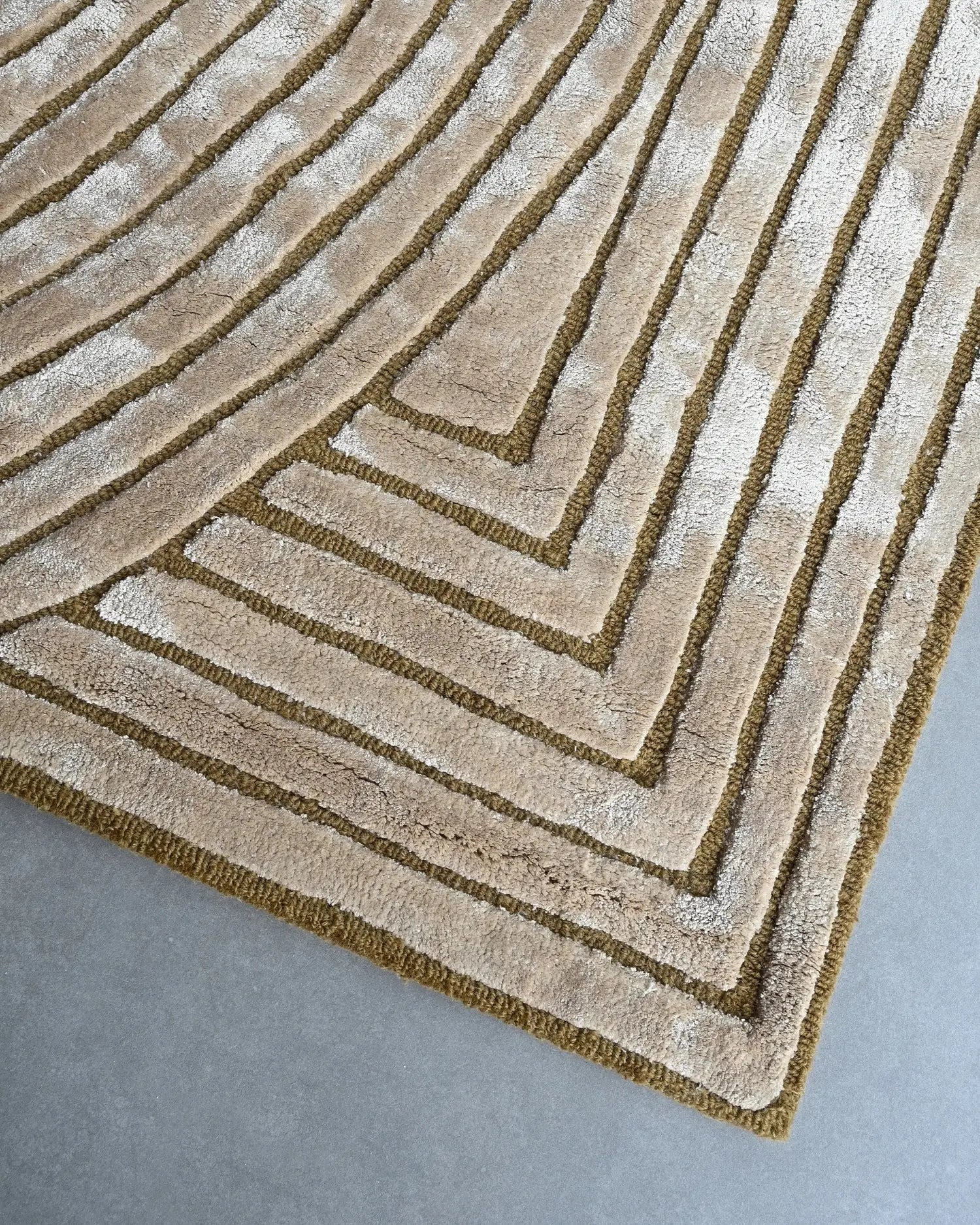 Beige and brown geometric patterned rug