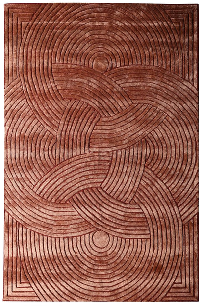 Brown hand tufted textured rug with circular pattern