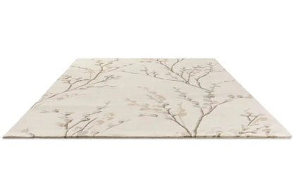 Beige floral-patterned wool rug