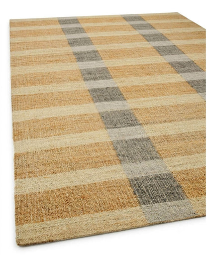 A rectangular woven jute area rug