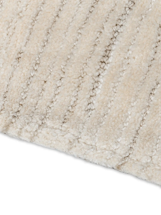 beige minimalist area rug