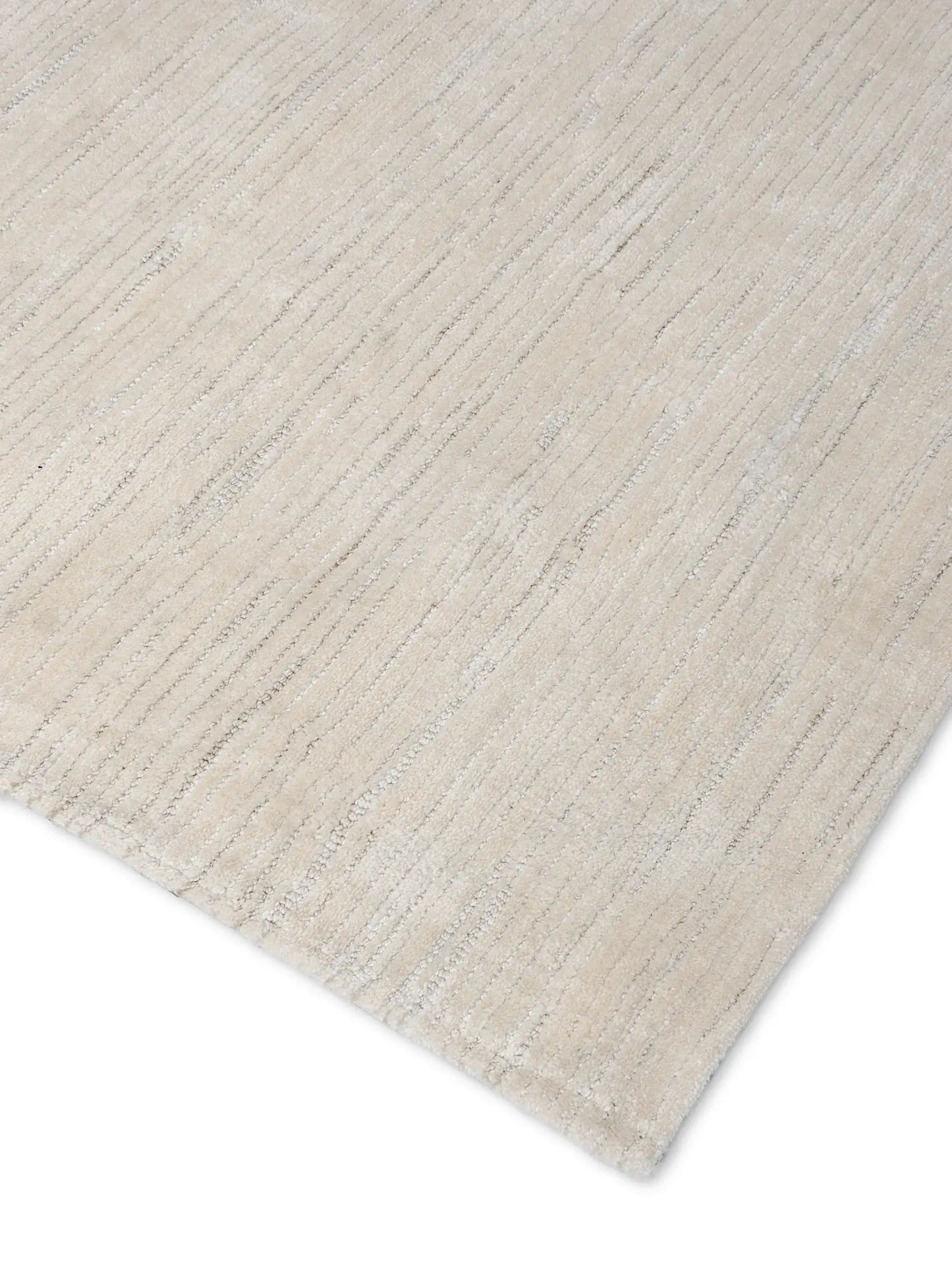 close up of hand tufted beige wool rug