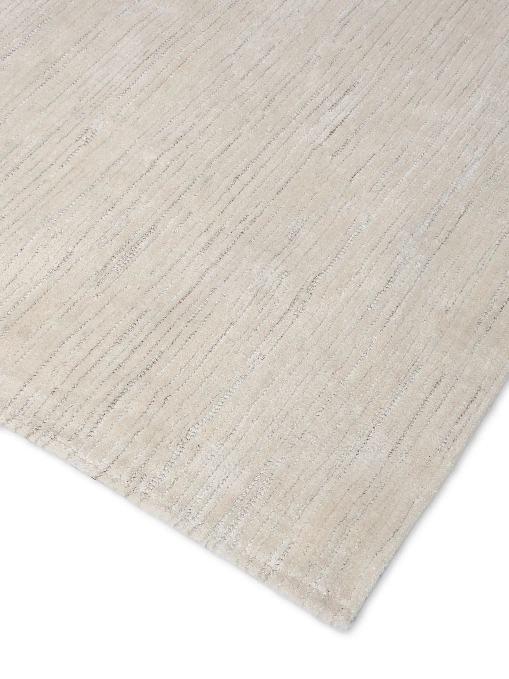 close up of hand tufted beige wool rug