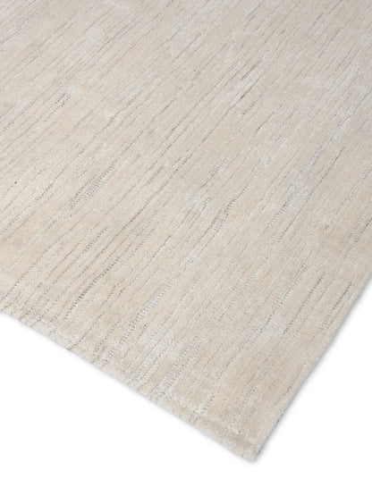 close up of hand tufted beige wool rug