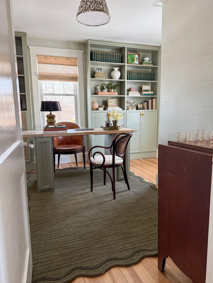 brown hand tufted wool rug in home office
