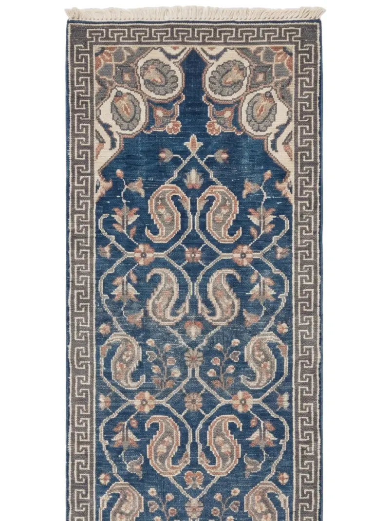 A traditional long wool runner rug