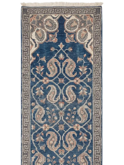 A traditional long wool runner rug