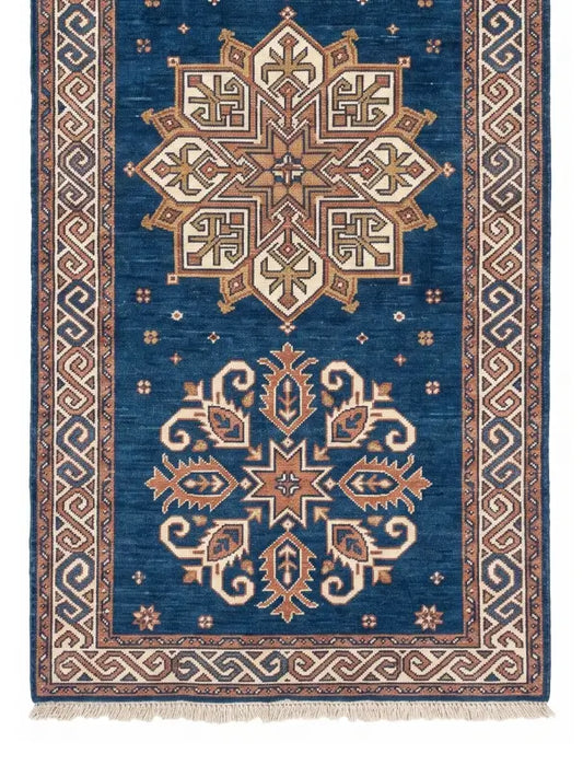 A traditional oriental-style runner rug with a deep blue field