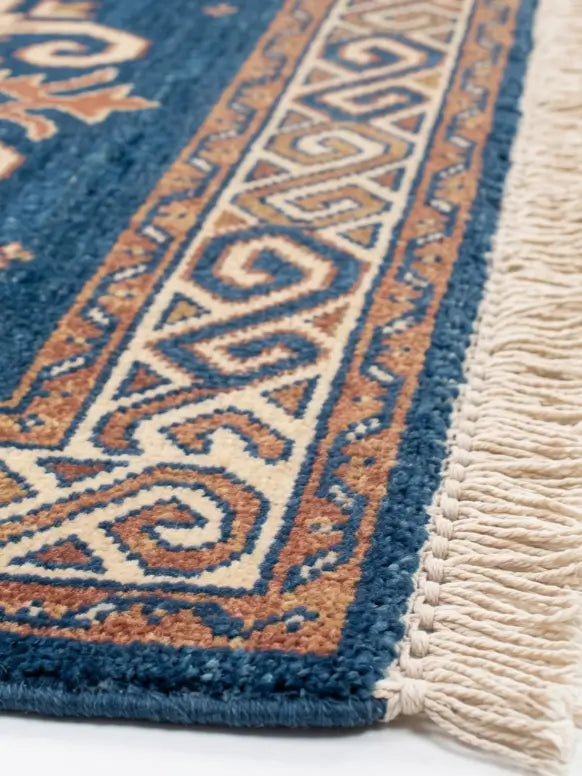 Close-up of a patterned area rug corner