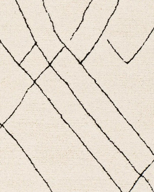 Close-up of a beige tufted wool rug