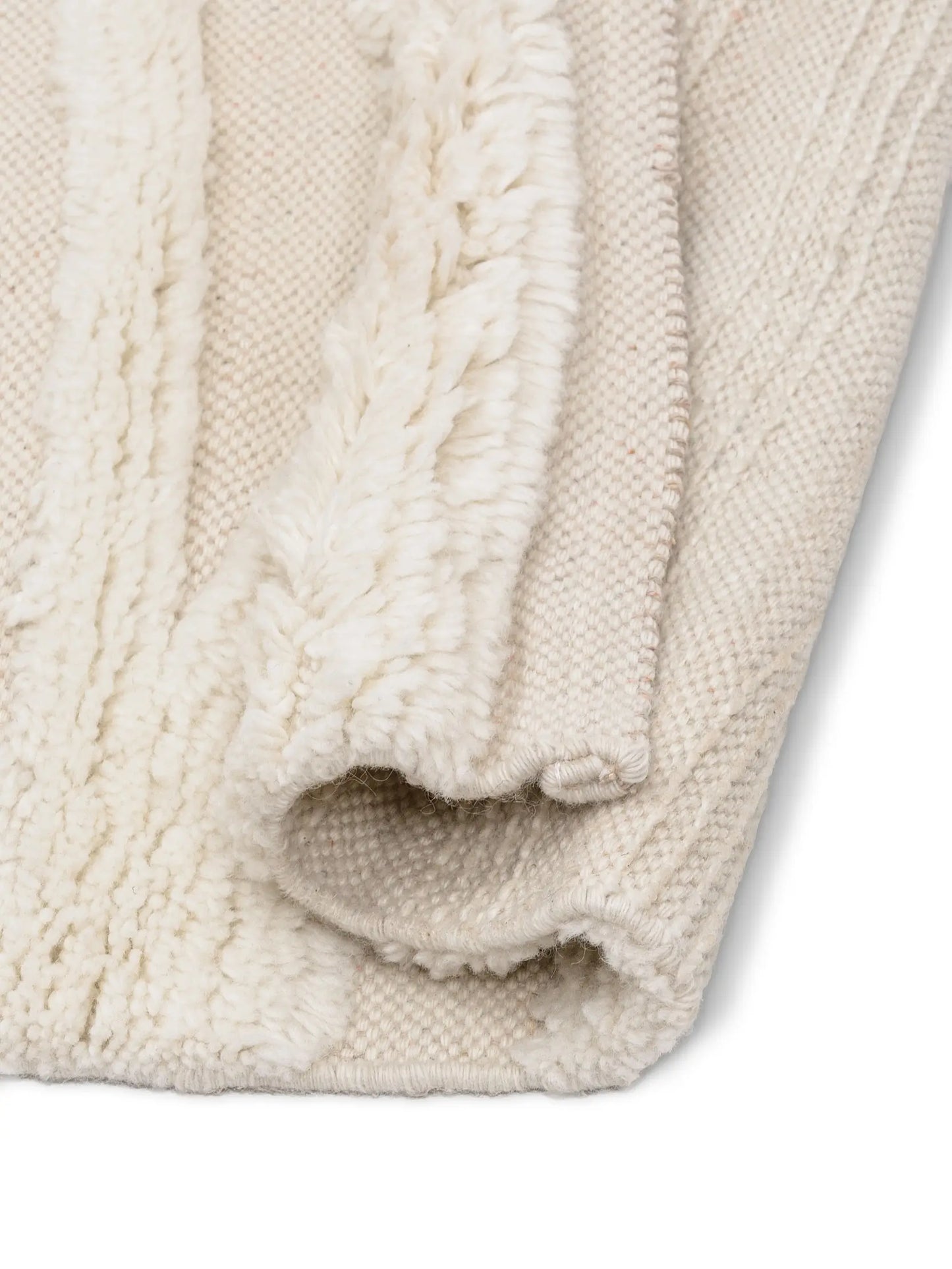 Close-up of a textured beige area rug for living room