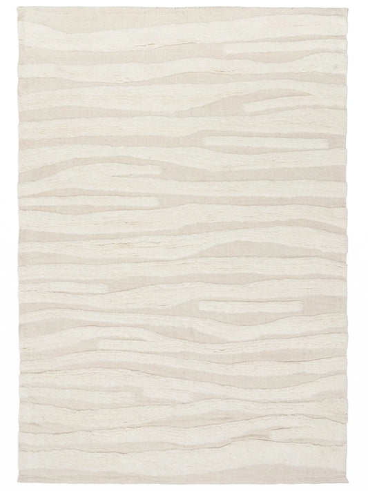 beige hand knotted wool rug with wave pattern