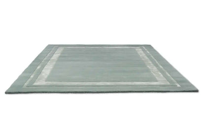 Rectangular rug with a striped border design