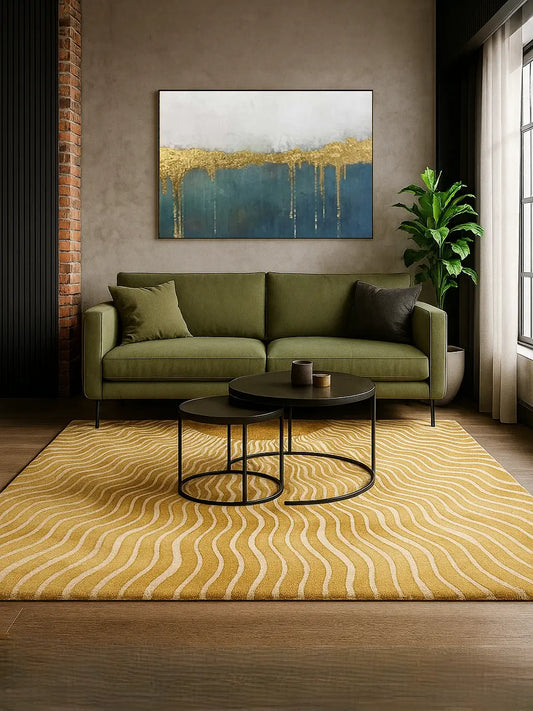 Modern living room with a green sofa, yellow wool and silk rug, and abstract painting.
