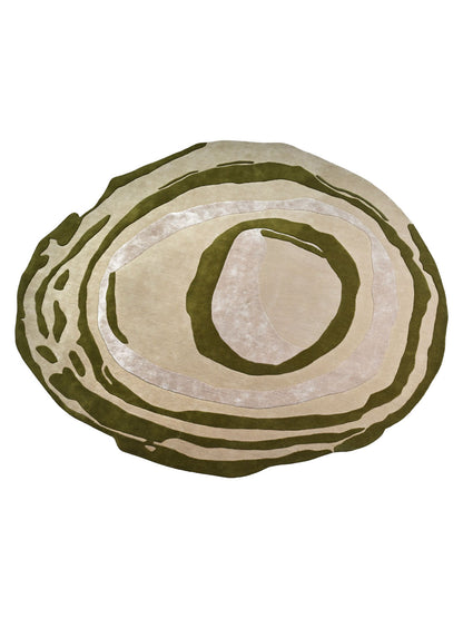 a round area rug with a layered, concentric design