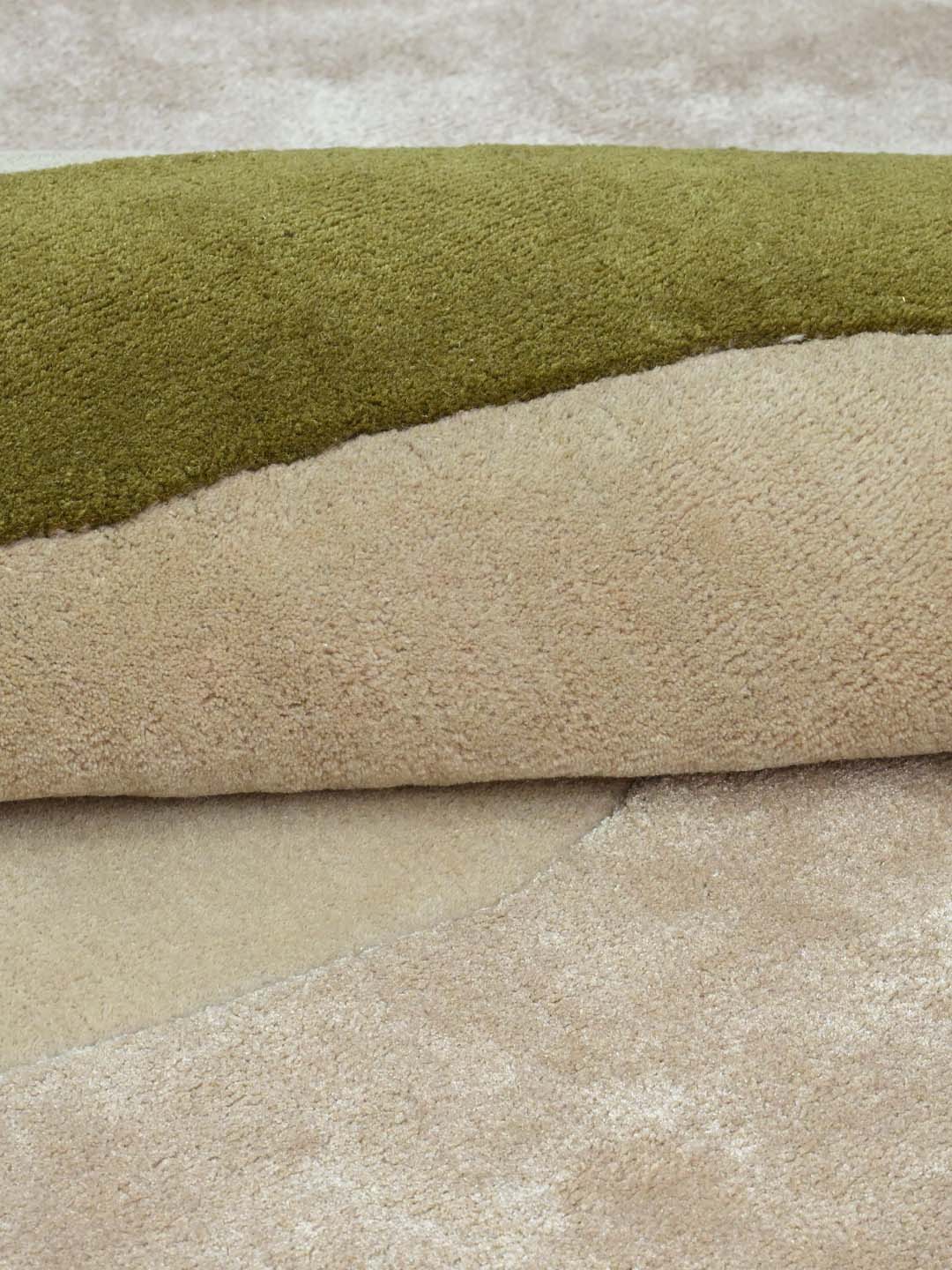 Close-up of a plush, textured hand tufted area rug
