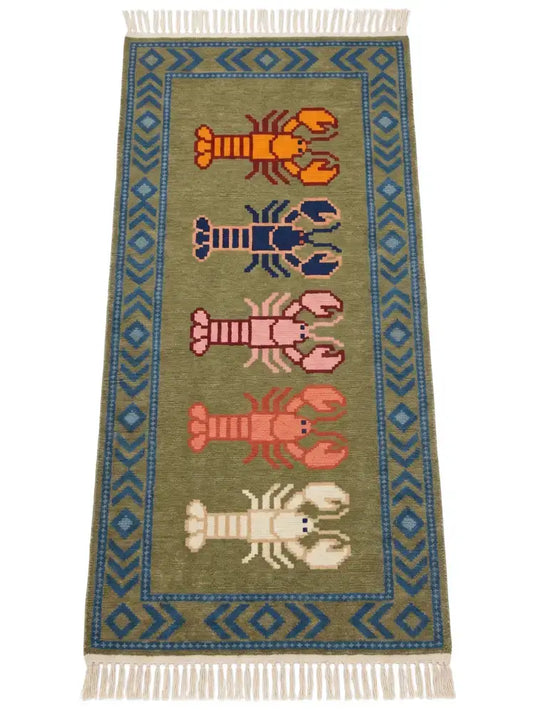 a hand knotted wool runner with stylized lobster motifs