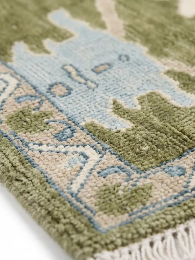 close up of hand knotted wool area rug
