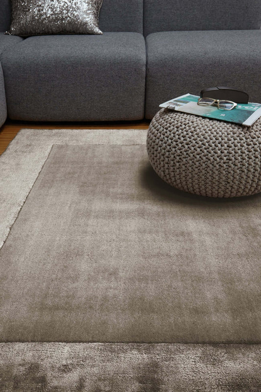 neutral taupe hand tufted rug in living room