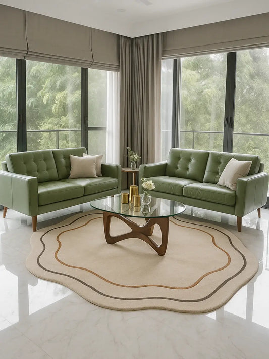 Modern living room with a beige shaped wol rug, a sofas, a glass coffee table, and large windows.