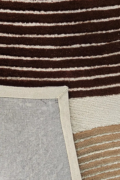 Close-up of a rug with brown and beige striped pattern