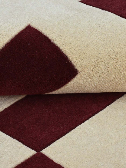 Close-up of a rug with brown geometric pattern on beige background