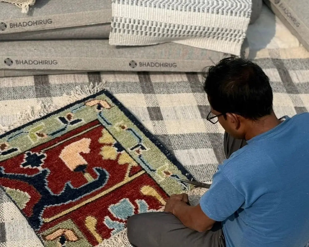 artisan making hand knotted rug